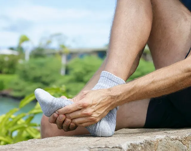Man Experiencing Metatarsal Pain after a walk